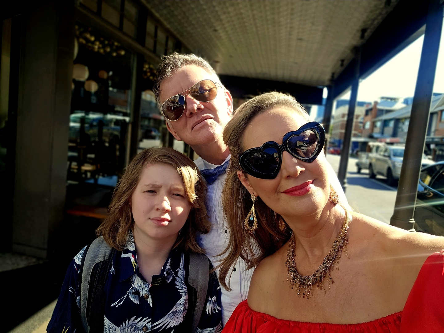 Craig in a bow tie with Trenna and one of the kids, dressed up on a Sydney street