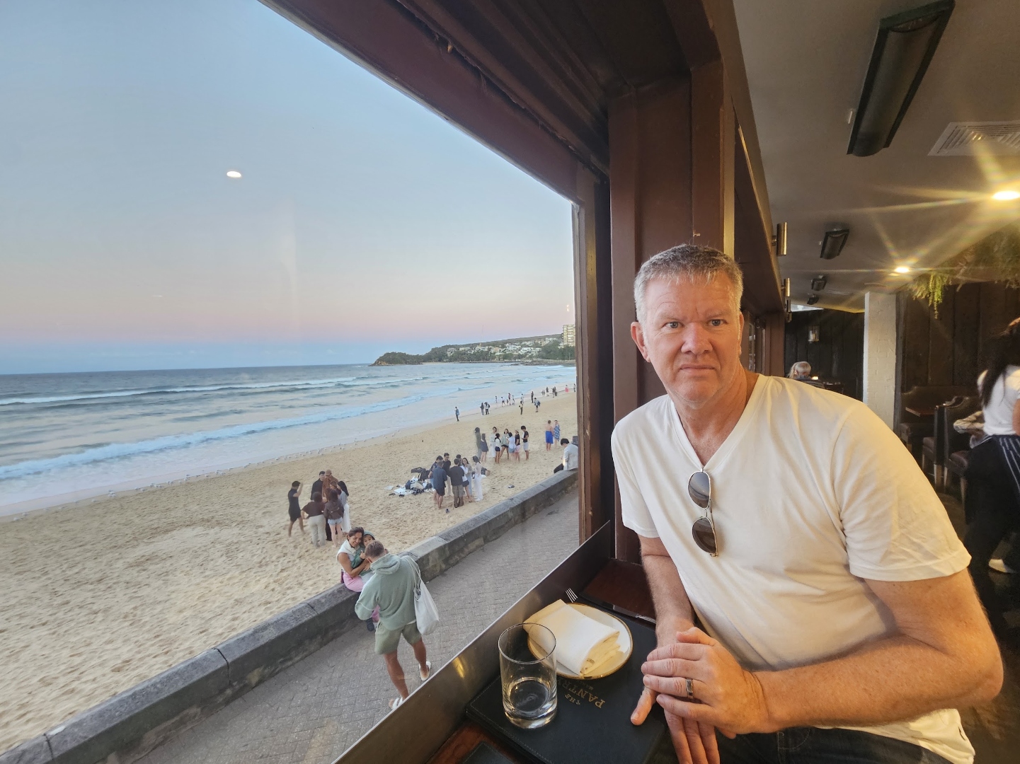 Craig Swanger, present day, at a beachfront window