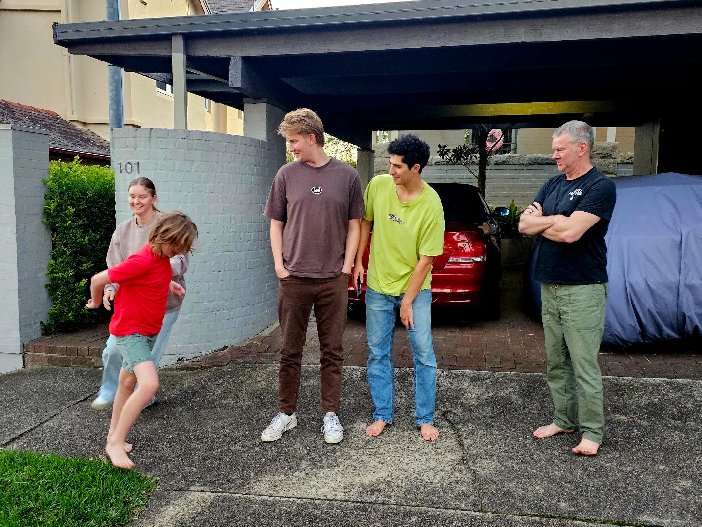The family being playful, one running