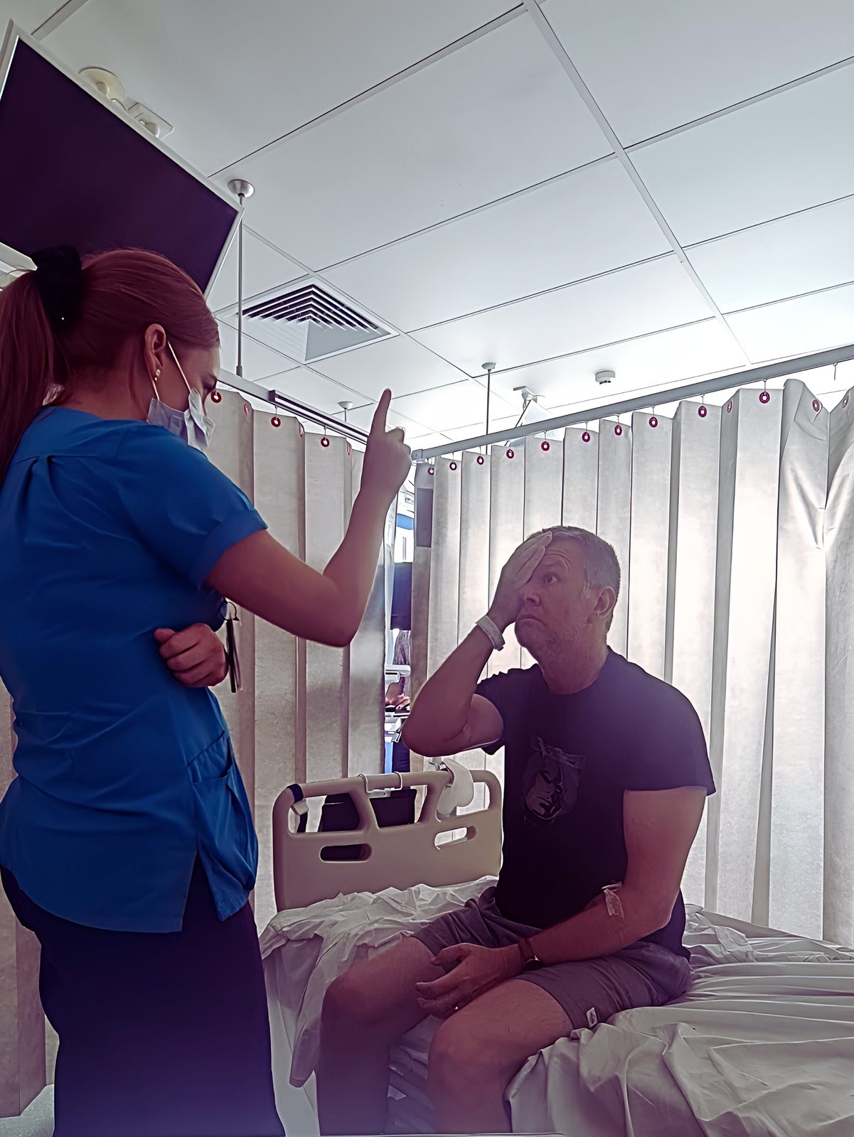 A speech pathologist working with Craig during a therapy session in hospital